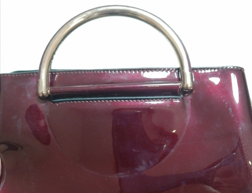 DUNE Oxblood Patent Satchel