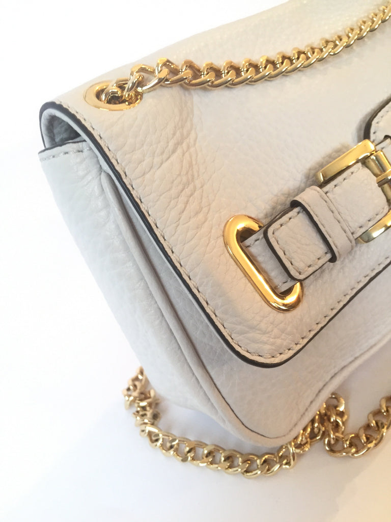 Closet Cravings - Sold**Michael Kors white leather purse with gold chain  strap. Can be worn as a shoulder bag or crossbody $138.75.